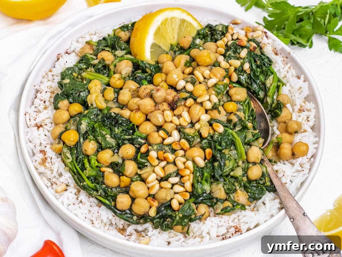 Chickpea Spinach Stew on rice with spoon