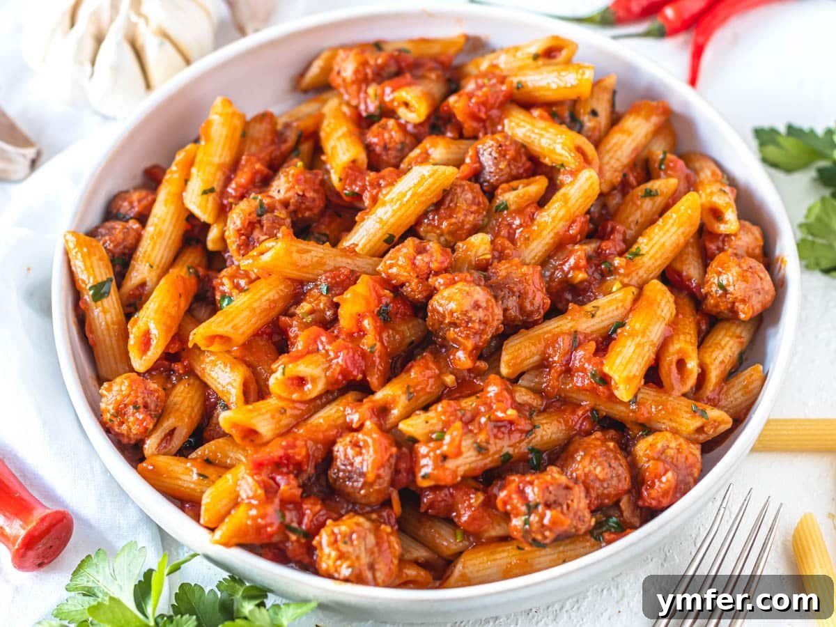 Protein-Packed Pasta Creations 11 Penne Arrabbiata generously mixed with small pieces of plant-based sausage.