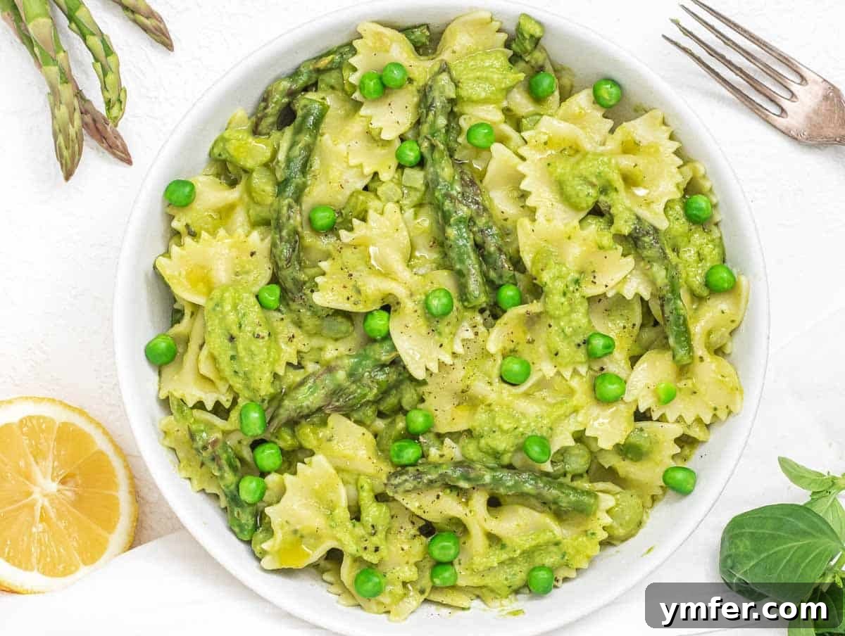 Protein-Packed Pasta Creations 15 Asparagus pasta with green peas, a fresh and colorful spring dish.