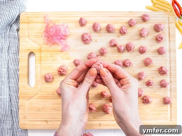 hands preparing plant-based meatballs