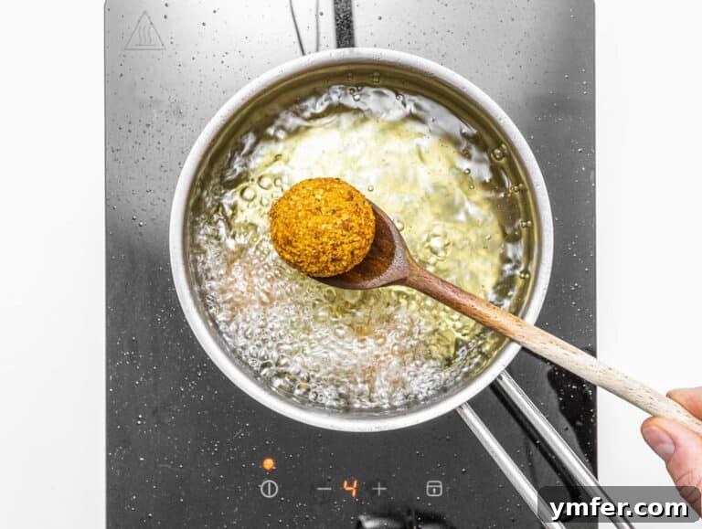 Creative Chickpea Flour Cuisine 28 fried falafel and wooden spoon