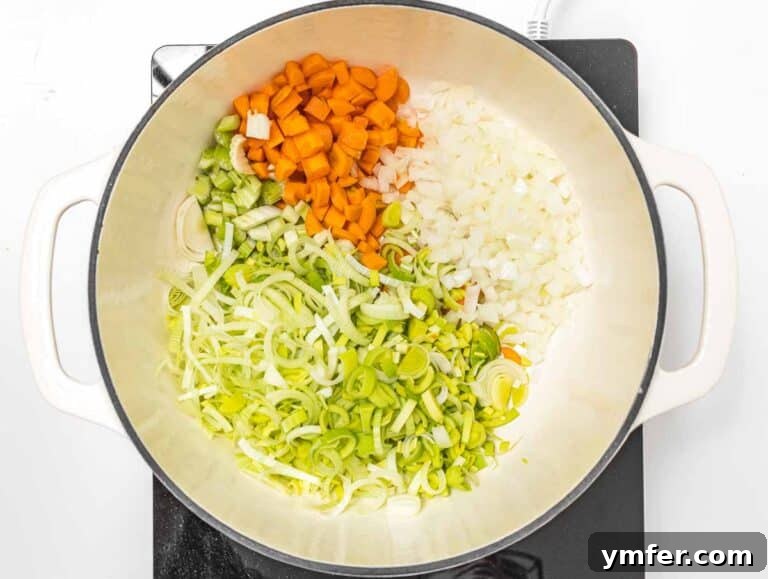 onion, celery and carrot gently sautéing in a Dutch oven