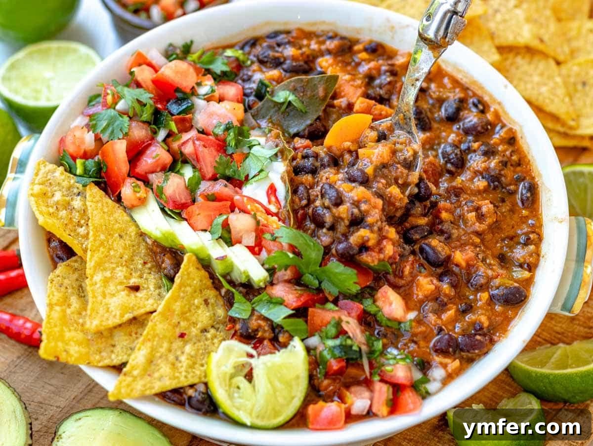 Fifteen Fantastic Black Bean Feasts 3 black bean soup topped with tortilla, pico de gallo, avocado, sour cream, cilantro, and lime juice.