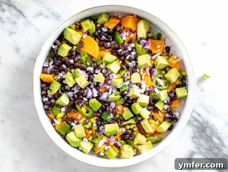 Fifteen Fantastic Black Bean Feasts 22 black beans, avocado, and sweet potatoes in a white bowl