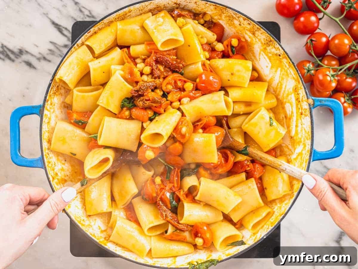 Paccheri: Italy's Grand Tubes 11 paccheri pasta, chickpeas and cherry tomatoes in a blue skillet
