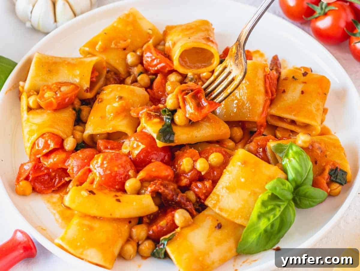 Paccheri: Italy's Grand Tubes 13 paccheri pasta with fork and chickpeas