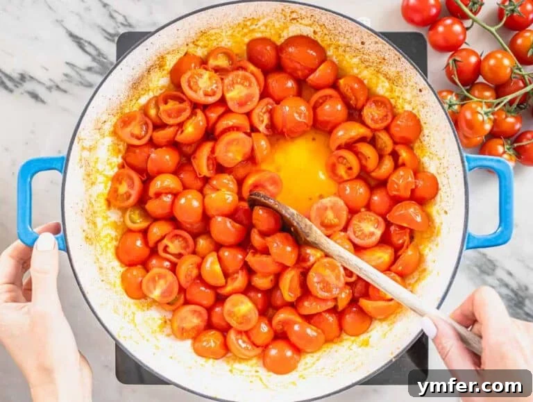 Paccheri: Italy's Grand Tubes 16 cherry tomatoes in a blue skillet