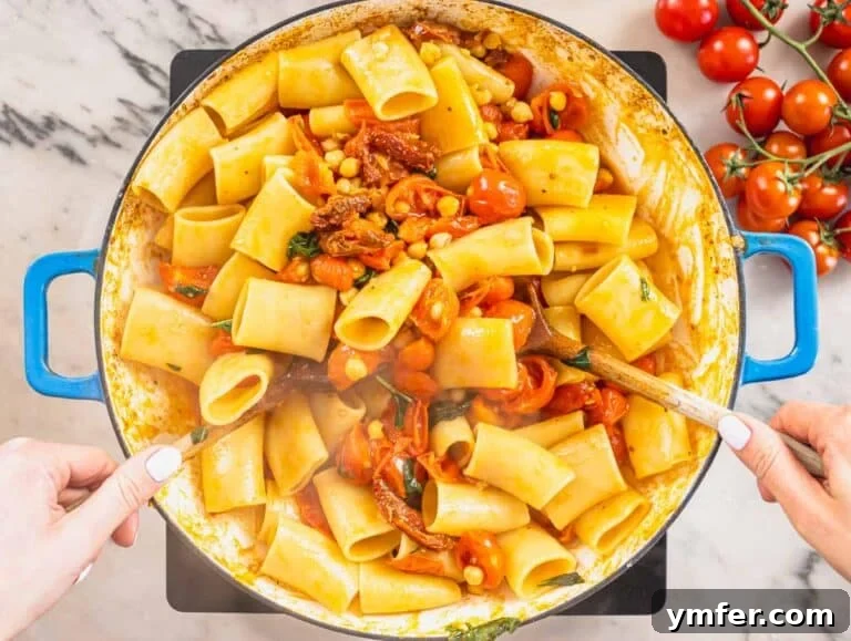 Paccheri: Italy's Grand Tubes 18 paccheri pasta, chickpeas and cherry tomatoes in a blue skillet