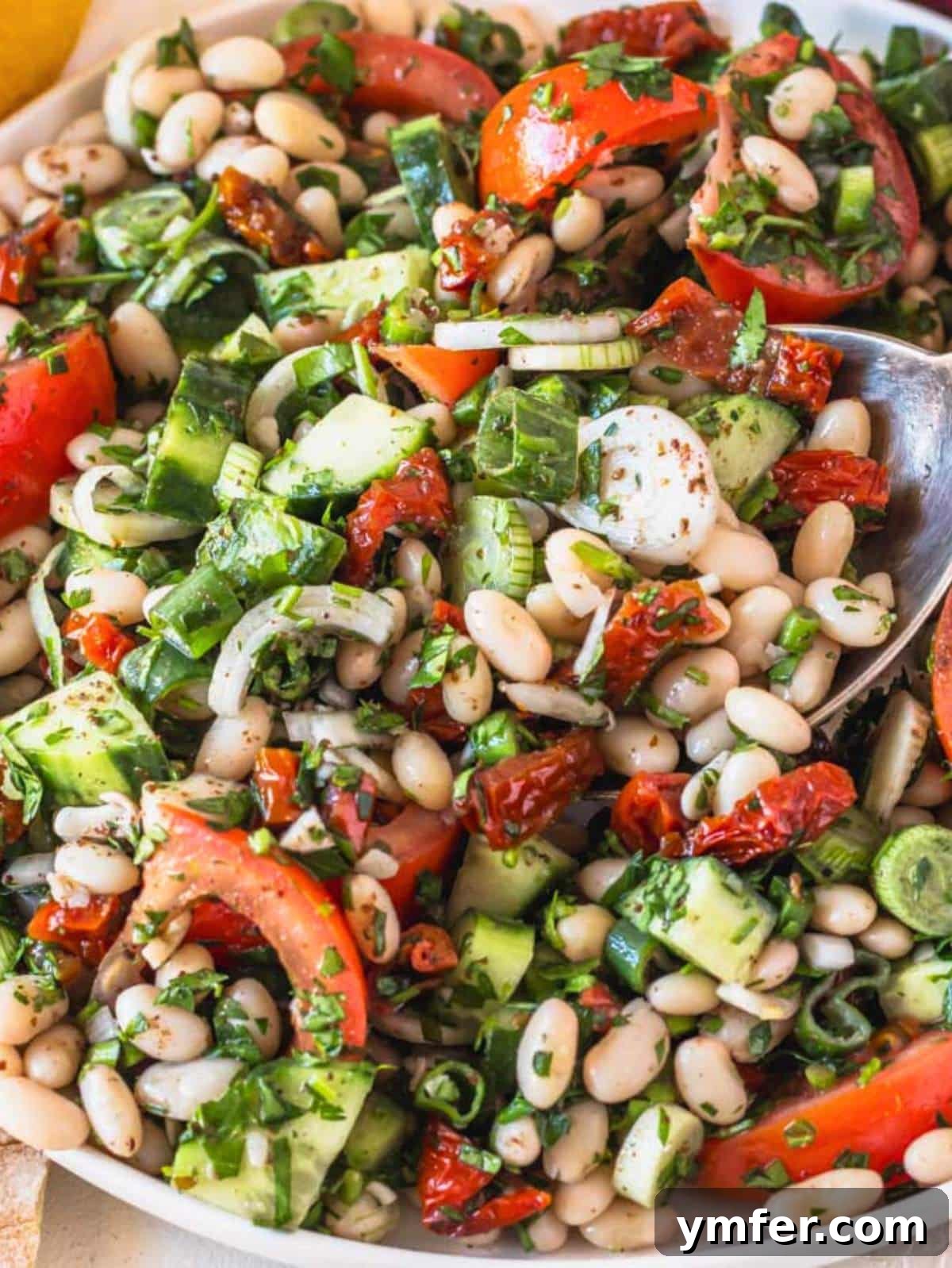 Mediterranean White Bean Salad 4 Close-up of freshly prepared white bean salad in a bowl.