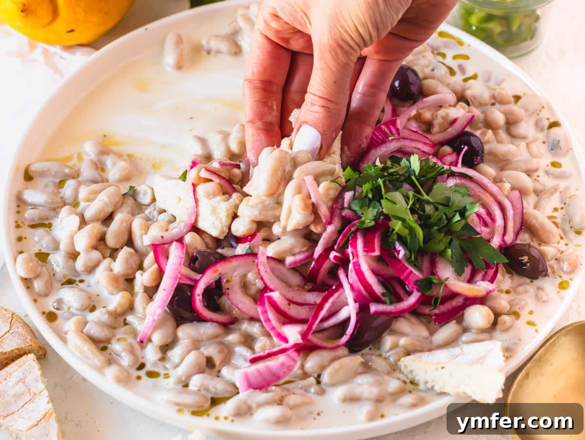 Piyaz Zesty Turkish White Bean Salad 16 Piyaz salad beautifully served as an appetizer with warm pita bread on a wooden board