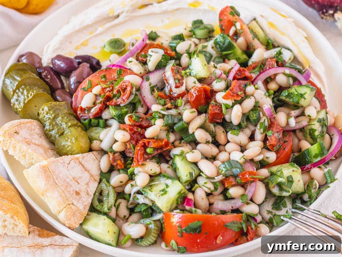 Piyaz Zesty Turkish White Bean Salad 17 A vibrant Mediterranean white bean salad served with pita bread and tahini yogurt sauce on the side