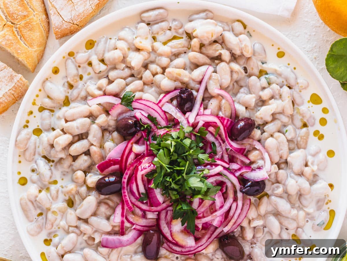 Piyaz Zesty Turkish White Bean Salad 3 Piyaz salad with vibrant red onions and fresh parsley garnish