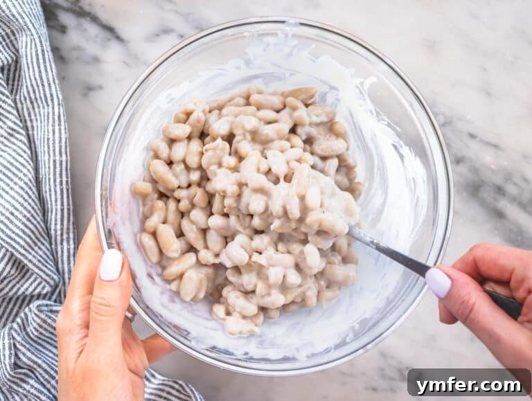 Piyaz salad after mixing in a glass bowl, creamy and consistent