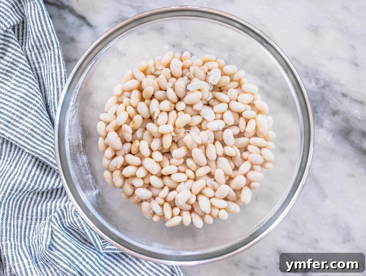 Piyaz Zesty Turkish White Bean Salad 9 Cooked and drained cannellini beans in a large glass mixing bowl