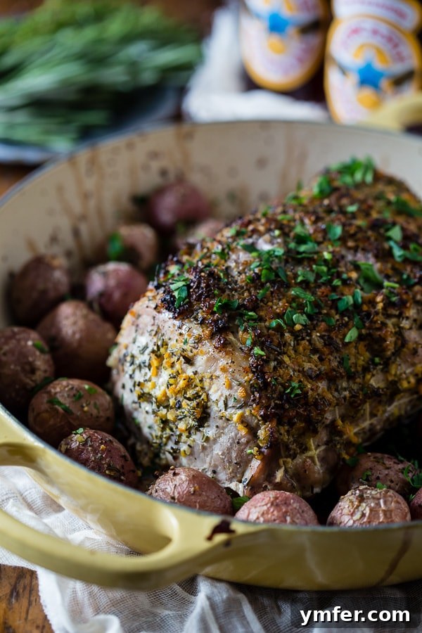 Golden Herb Citrus Pork Roast 2 This citrus herb crusted pork roast is perfect for the holidays. Rubbed down with flavor packed topping and roasted with small baby potatoes. Easy and delicious!