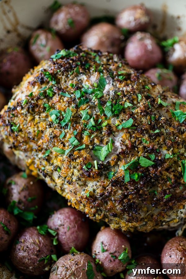 Golden Herb Citrus Pork Roast 3 This citrus herb crusted pork roast is perfect for the holidays. Rubbed down with flavor packed topping and roasted with small baby potatoes. Easy and delicious!