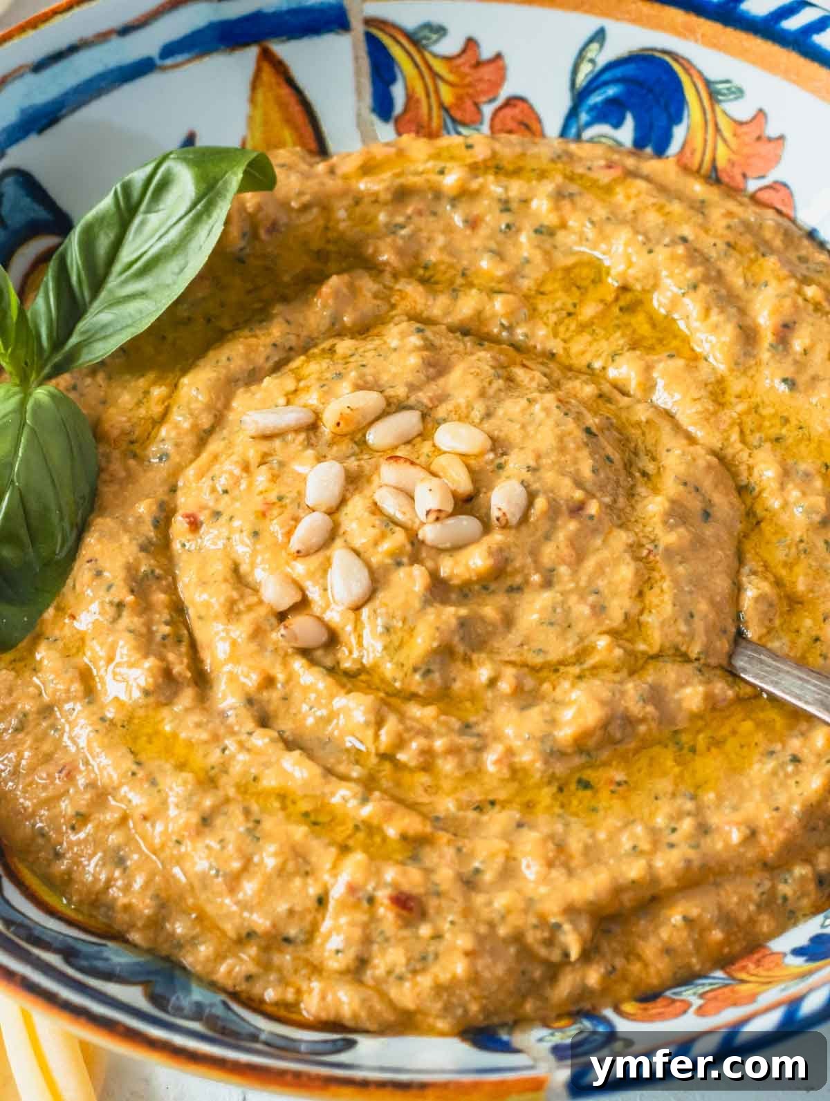 Sicilian Red Pesto 2 red pesto in a bowl with pine nuts and fresh basil