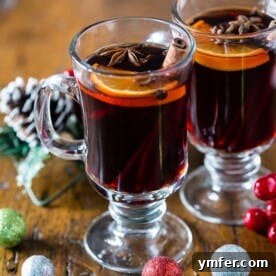 Fireside Simmered Spiced Wine 5 This slow cooker spiced mulled wine is perfect for large holiday gatherings. So warm and comforting it's bound to be the drink of the season. Plus it's kept warm all night long by heating in the slow cooker.