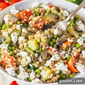 Sardinia's Toasted Pearl Pasta 18 creamy fregola with peas, zucchini and cherry tomatoes, a vibrant and delicious dish