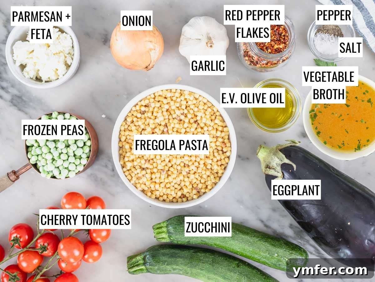 Sardinia's Toasted Pearl Pasta 6 A vibrant display of fresh ingredients laid out for creamy fregola pasta, including chopped vegetables, herbs, and pasta.