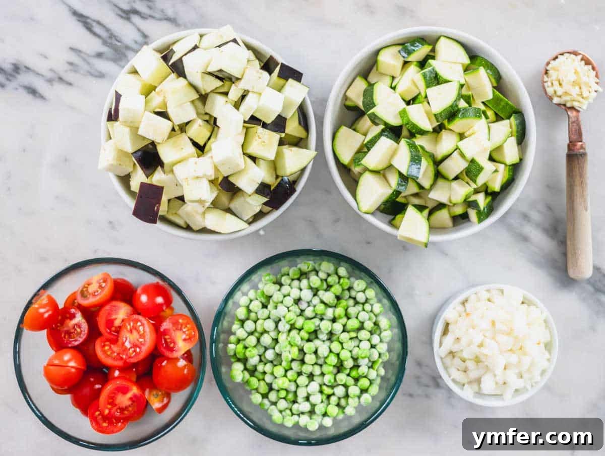 Sardinia's Toasted Pearl Pasta 8 Bowls of prepped vegetables including frozen peas, ready for cooking.